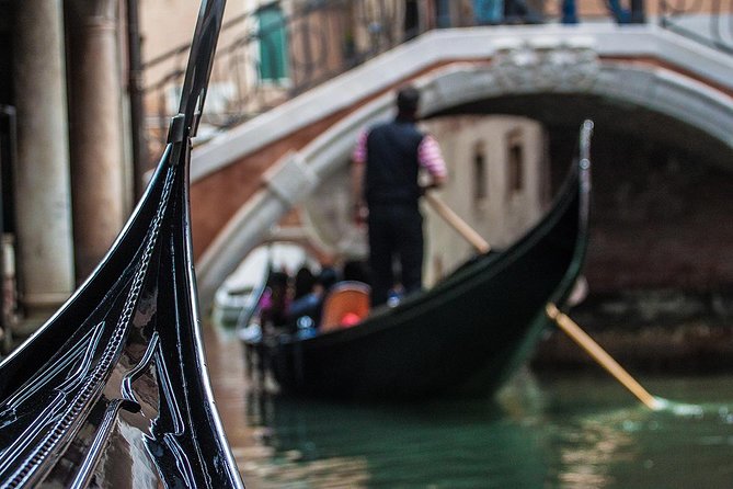 Enchanting Venice: Private Gondola Experience - A traditional boat, not a floating sightseeing bus