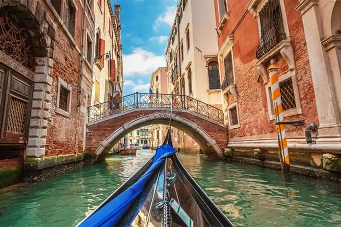 Explore the Canals on an Authentic Gondola Tour Venetian Dreams - Sharing the gondola with up to five people