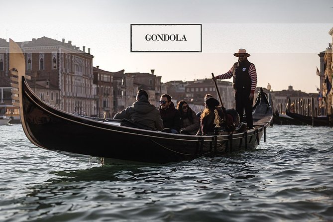 Grand Canal Gondola Experience with Live Commentary™ - A traditional boat with a shared seat