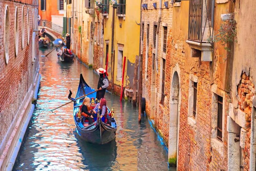 Venice: Gondola Ride Along Grand Canal and Hidden Corners - Turning into Venice’s quieter canals