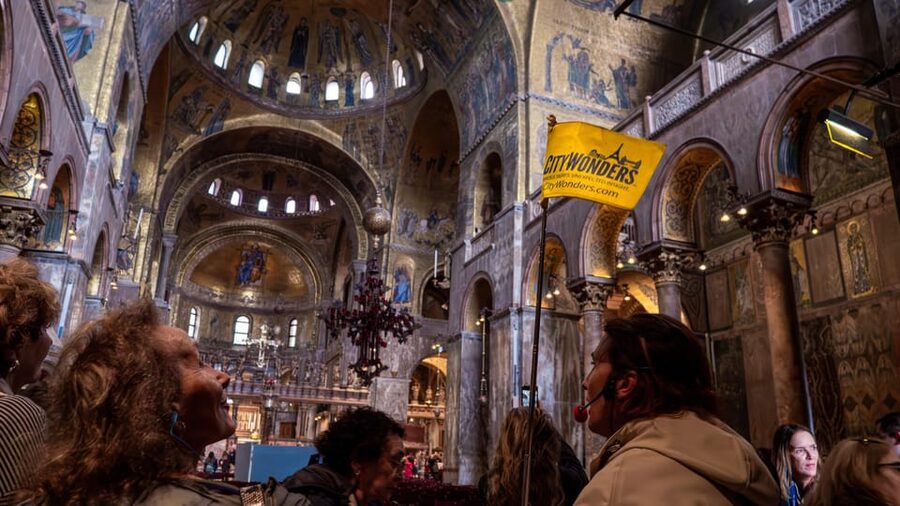 Venice: St. Mark's Basilica Guided Tour and Gondola Ride - Meeting beneath the Clock Tower arches