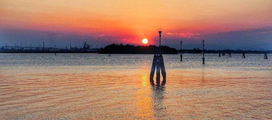 Venice: Sunset or Evening Gondola Tour - Boarding a shared Venetian gondola